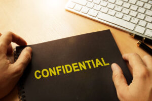 Document with label confidential on a table.